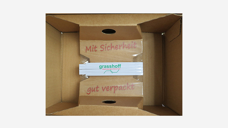 Bedruckte Korrvu Fixierverpackung mit Werbegeschenk